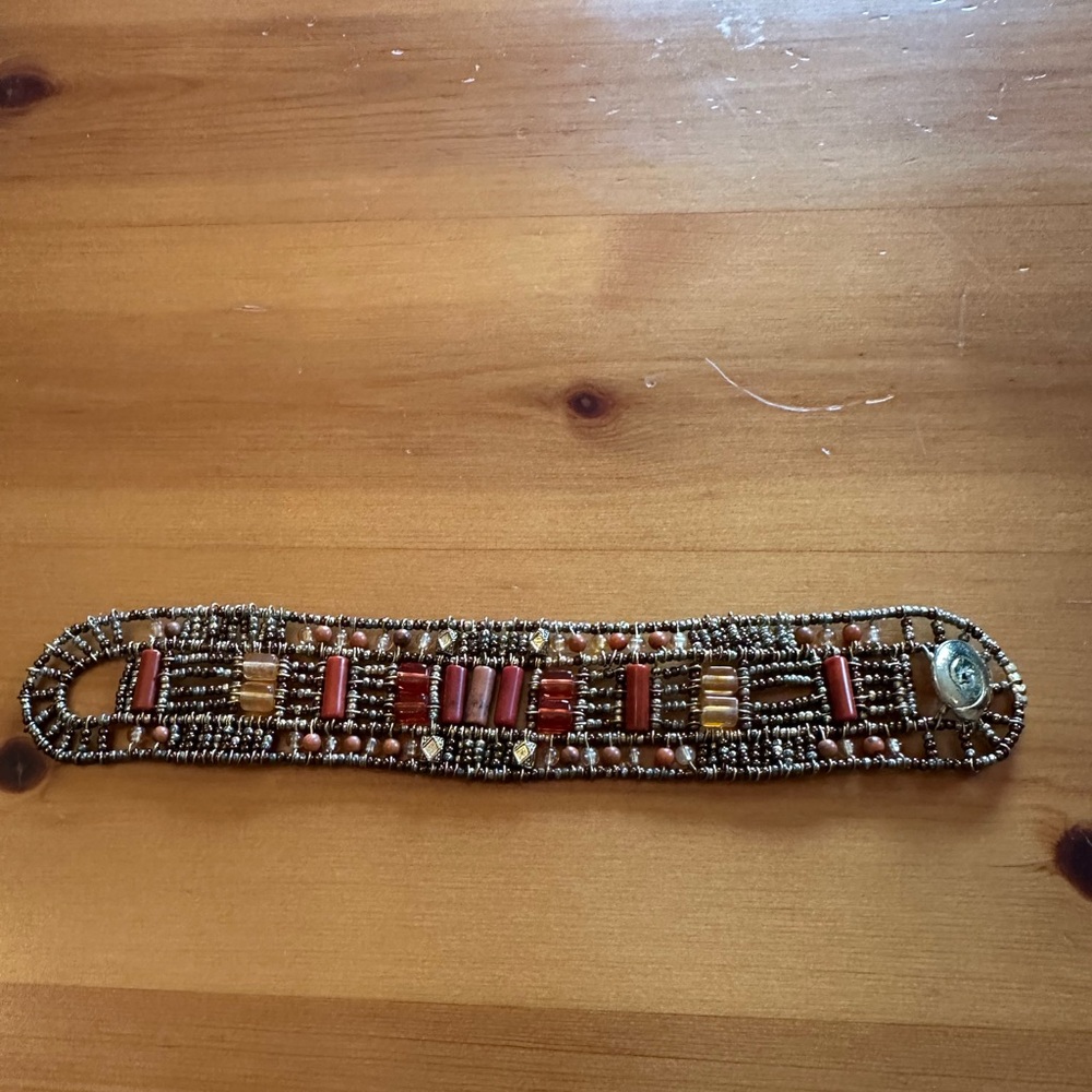 Orange and gold beaded bracelet, preowned.
